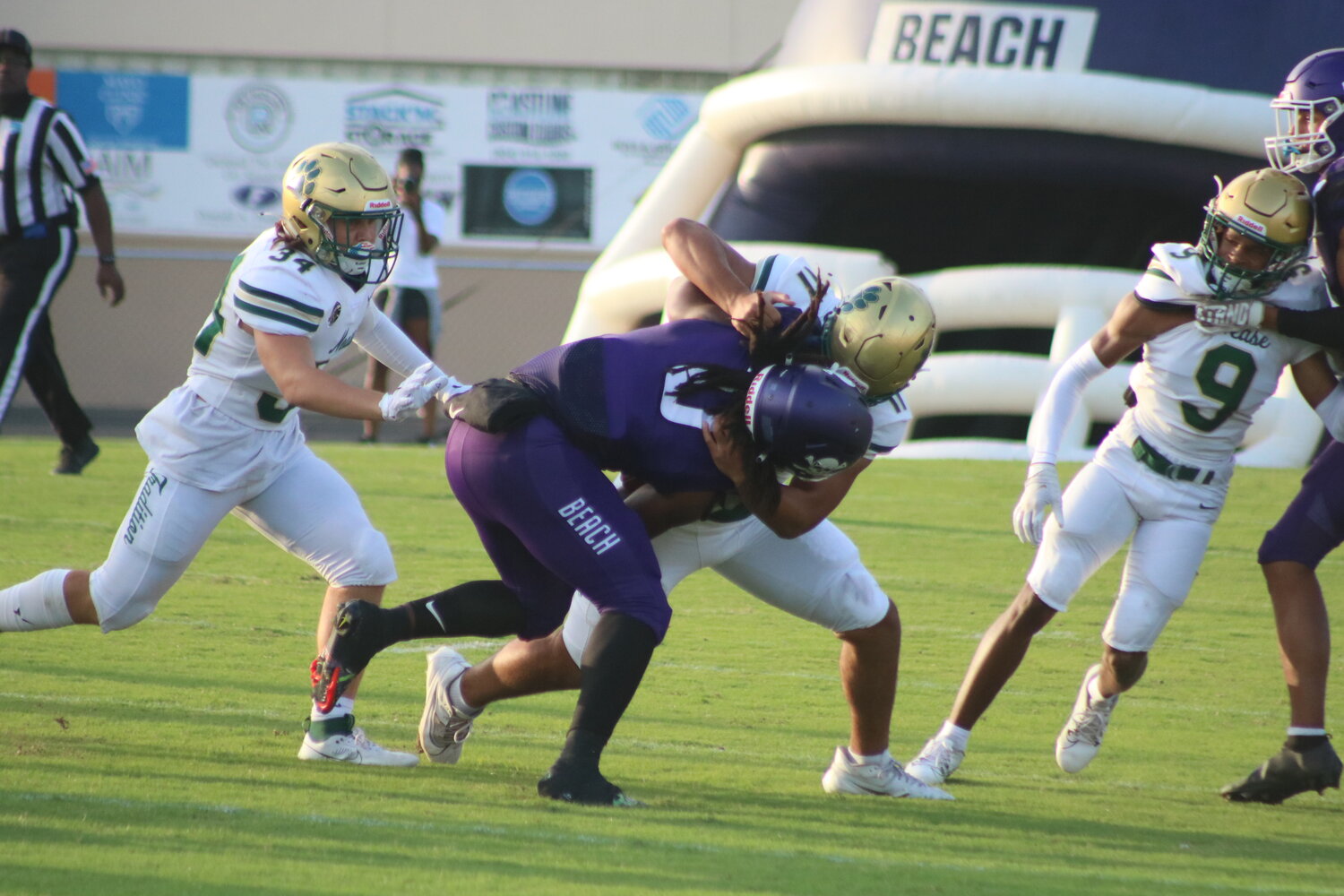 Noah Hellyer drags down a Fletcher ball carrier as the Panther defense swarms to the ball.